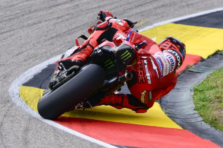 Marc Marquez claims pole position in rain-soaked German MotoGP
