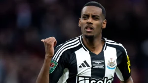Alexander Isak gestures during a match, wearing a Newcastle United kit featuring details of the Carabao Cup Final against Liverpool, held at Wembley Stadium on 16 March 2025.